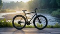 Black bike on wooden floor near the rivers background at morning.