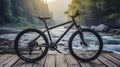Black bike on wooden floor near the rivers background at morning.