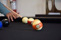 Black billiard table, Playing billiard - Close-up shot of a man playing billiard Royalty Free Stock Photo