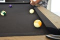 Black billiard table, Playing billiard - Close-up shot of a man playing billiard Royalty Free Stock Photo