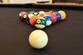 Black billiard table, Playing snooker pool 8ball - Close-up shot of a man playing billiard Royalty Free Stock Photo