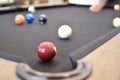 Black billiard table, Playing snooker pool 8ball - Close-up shot of a man playing billiard Royalty Free Stock Photo