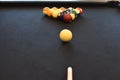 Black billiard table, Playing snooker pool 8ball - Close-up shot of a man playing billiard Royalty Free Stock Photo