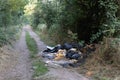 Illegal fly tipping on a country track in the UK