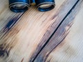 Binocular on wooden background top