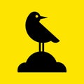 Black bird icon. Vector illustration. Black bird icon isolated on yellow background. Royalty Free Stock Photo