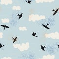 Black birds silhouette and white clouds with blue sky. Seamless repeat pattern for wallpaper, background and textile design. Vecto Royalty Free Stock Photo