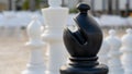 A black Bishop chess piece ready to move against an opponent Royalty Free Stock Photo