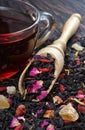 Black blended tea with flower petals and dried fruit Royalty Free Stock Photo