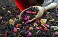 Black blended tea with flower petals and dried fruit Royalty Free Stock Photo