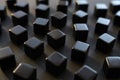 Black blocks on a dark background. Scattered cubes. Abstraction, field blur. Simplicity and elegance. Royalty Free Stock Photo