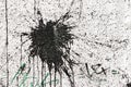Black blot at white stucco Royalty Free Stock Photo