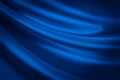 Black blue abstract background. Dark blue silk satin fabric texture background. Liquid wave effect. Royalty Free Stock Photo