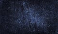 Black blue background with light white spots, particles. Dark blue old rough rusty metal plate surface. Grunge background. Royalty Free Stock Photo