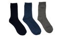 Black, blue, gray socks on white background. Royalty Free Stock Photo