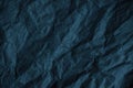 Black blue green crumpled rough paper background. Wrinkled texture of colored packaging.