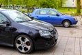 Black blue passenger car vehicles parked in the parking lot Royalty Free Stock Photo