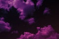 Black blue purple magenta sky with clouds. Glowing twinkling stars. Fantastic colorful night sky background. Royalty Free Stock Photo