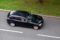Black BMW 1-Series E87 hatchback with motion blur effect Royalty Free Stock Photo