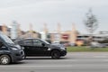 The black BMW X6 drives at high speed on the road. Motion blur. Riga, Latvia - 09 Sep 2021