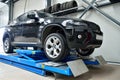 Black BMW X6 on elevator inside car service