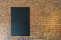 Black board on brick wall background