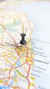 A black board pin stuck in Newcastle Upon Tyne on a map of England portrait Royalty Free Stock Photo