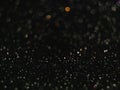 Black bokeh background with defocused lights. Royalty Free Stock Photo