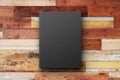 Black book cover on a vintage wooden surface Royalty Free Stock Photo