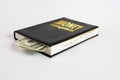 Black book with money and the inscription money management on white background Royalty Free Stock Photo