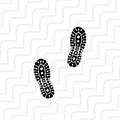 black boot tracks on curvy line background flat vector design