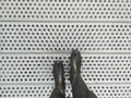 Black boots on a metal platform Royalty Free Stock Photo