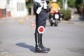 black boots and traffic pallet of a traffic policeman in the cit