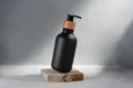 Black bottle with dispenser pump for liquid soap, gel, lotion, cream, shampoo and other cosmetics Royalty Free Stock Photo