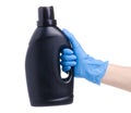 Black bottle laundry gel in cleaning glove hand