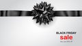 Black bow with horizontal ribbon with shadow and inscription Black Friday Sale Royalty Free Stock Photo