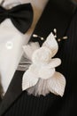 Wedding artificial white flower on a suit