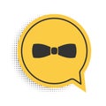 Black Bow tie icon isolated on white background. Yellow speech bubble symbol. Vector Royalty Free Stock Photo