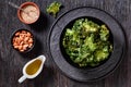 Black bowl with kale chips on the table Royalty Free Stock Photo