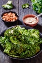 Black bowl with kale chips on the table Royalty Free Stock Photo