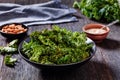 Black bowl with kale chips on the table Royalty Free Stock Photo