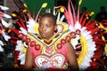 A black boy of African descent dressed in costume for Junkanoo