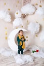 Black boy close up Portrait . Portrait of a cheerful smiling boy in a yellow scarf. Childhood. Little black boy with a rose. Congr Royalty Free Stock Photo