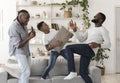 Black boy, his dad and grandfather dancing and singing in living room
