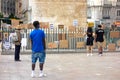 Black boy looking at the banners left on a fence after the demonstration of the black lives matter in Madrid