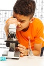 Black boy looking in microscope Royalty Free Stock Photo