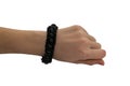 Black bracelet mock-up on a man`s arm. Empty layout of the design of wrist banners. Cheap bracelets, isolated.