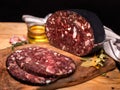 Black brawn, blood sausage, black pudding on a wood cutting board, close up. Polish cold cuts, meat products.