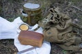 Bread and military flask on a white towel