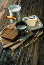 Black bread and milk on old wooden